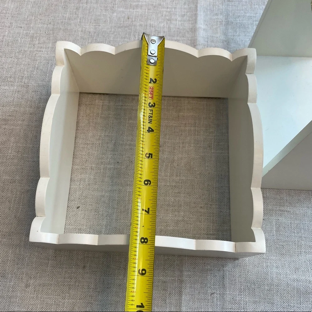 Two wall hanging white shadow boxes.